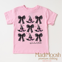 Witch Hats And Bows Halloween design on a pink garment.
