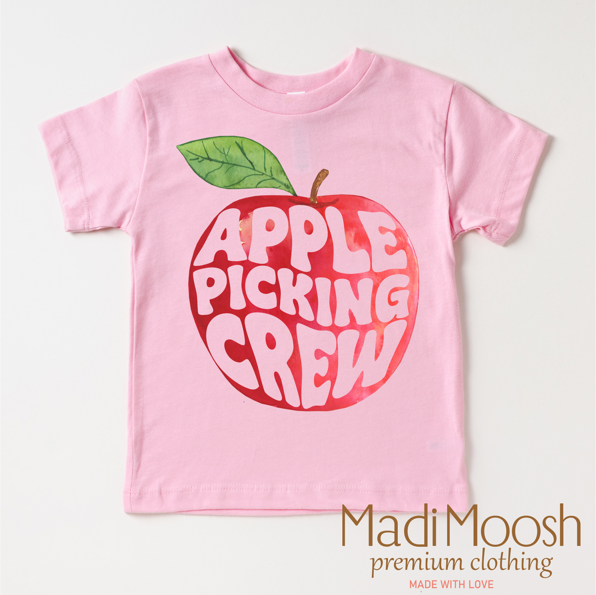 Apple Picking Crew design on a pink garment.