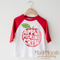 Apple Picking Crew design on a red-accented shirt.