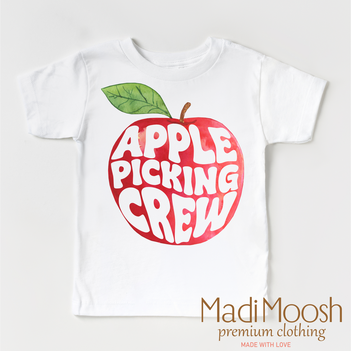 Apple Picking Crew design on a white garment.