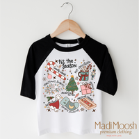 Tis The Season Christmas design on a black-accented shirt.