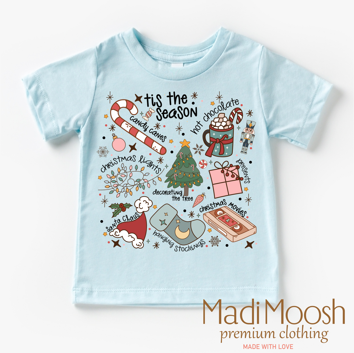 Tis The Season Christmas design on a blue garment.