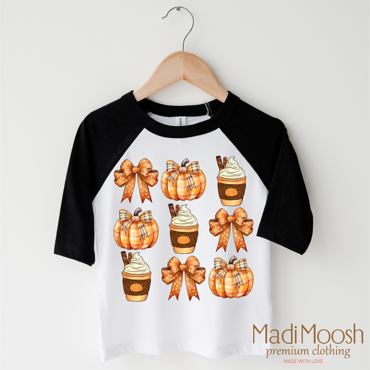 Pumpkins design on a black-accented shirt.