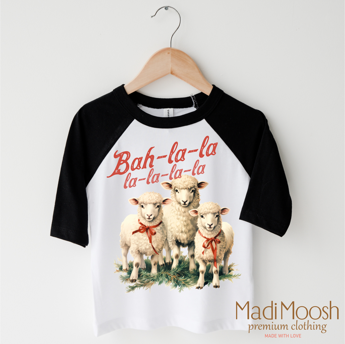 Bah-La-La-La Lamb Christmas design on a black-accented shirt.