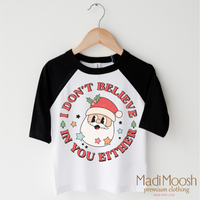 I Don't Believe In You Either Christmas design on a black-accented shirt.