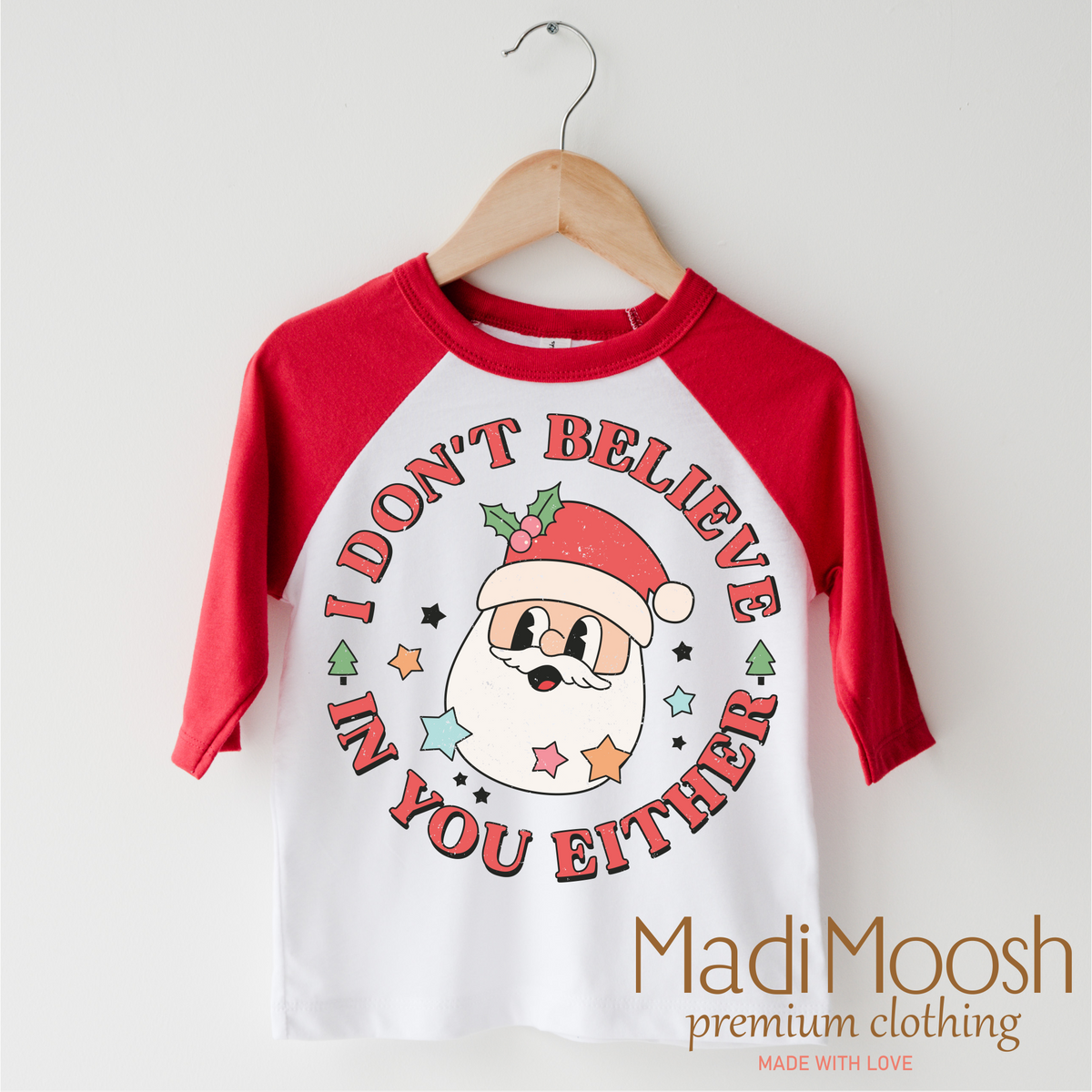 I Don't Believe In You Either Christmas design on a red-accented shirt.