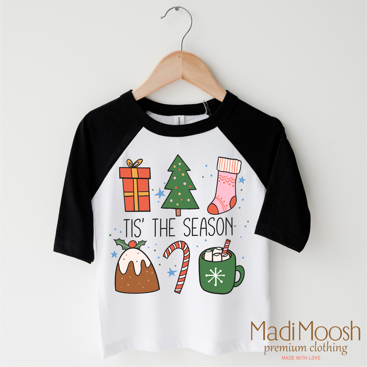 Tis The Season Christmas design on a black-accented shirt.