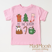 Tis The Season Christmas design on a pink garment.