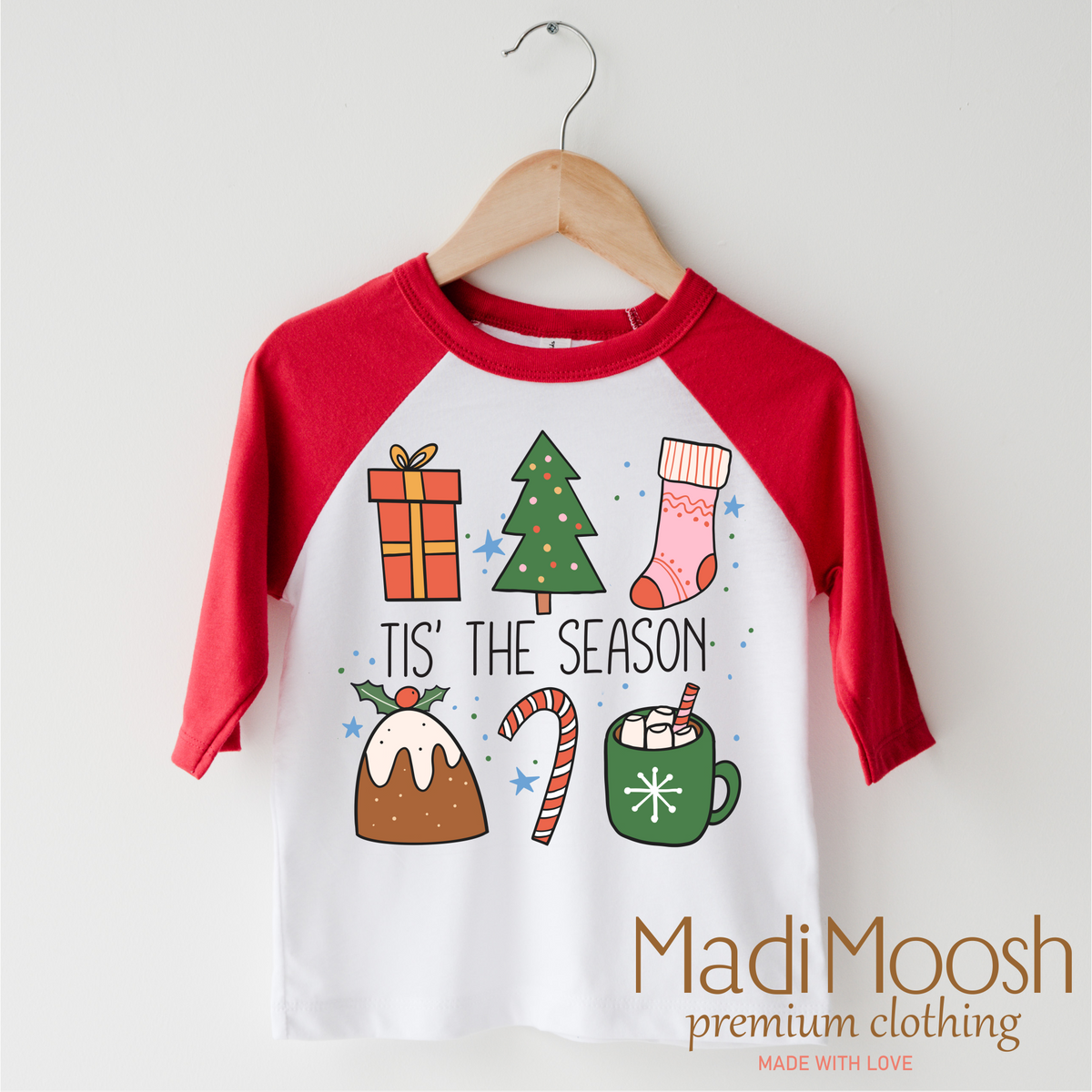 Tis The Season Christmas design on a red-accented shirt.