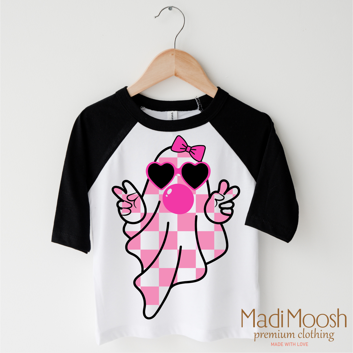 Cute Ghost Blowing Bubbles Halloween design on a black-accented shirt.