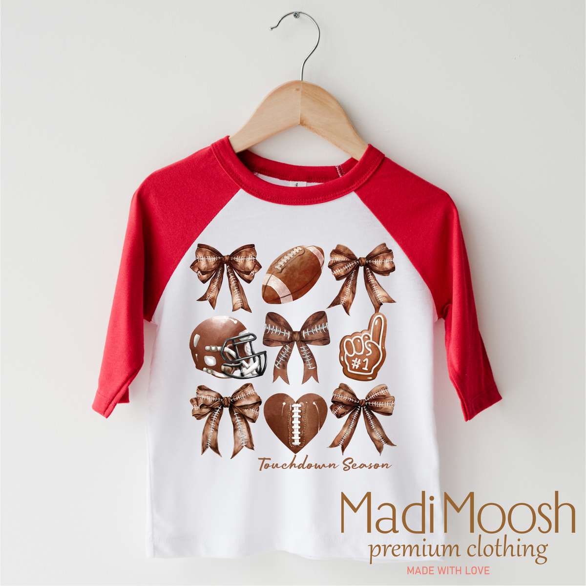 Football And Bows Girls design on a red-accented shirt.