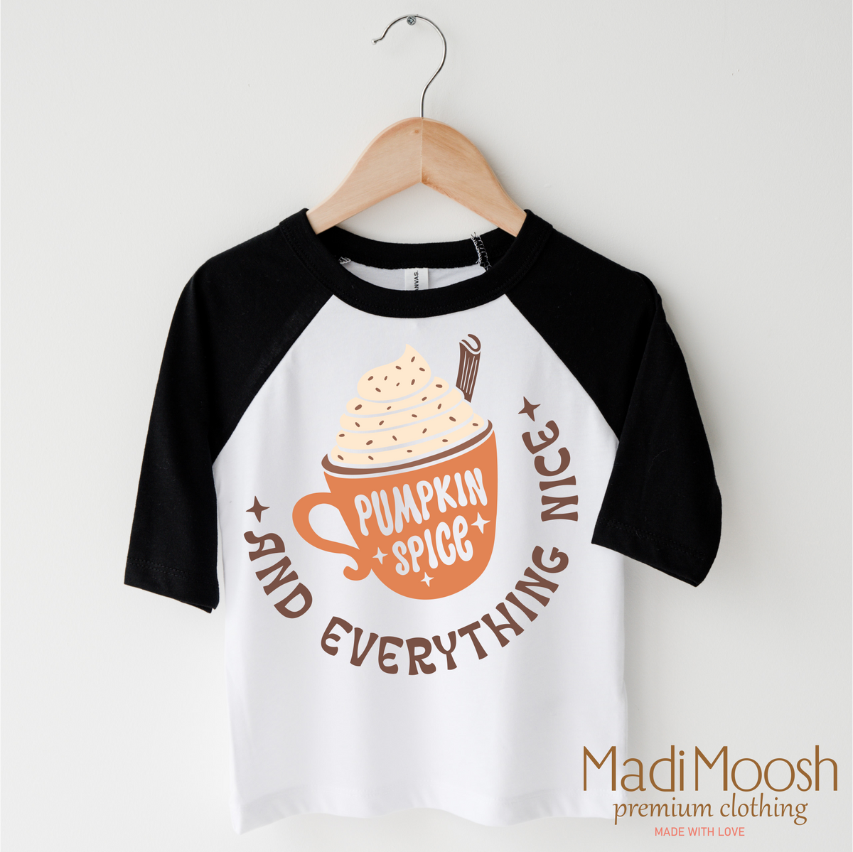 Pumpkin Spice And Everything Nice Fall design on a black-accented shirt.