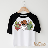 Cowboy Santa Christmas design on a black-accented shirt.