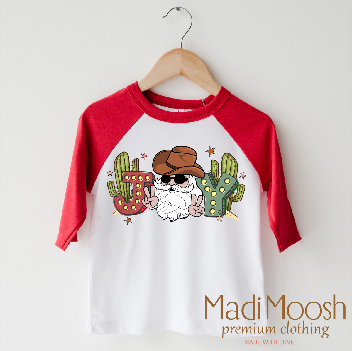 Cowboy Santa Christmas design on a red-accented shirt.