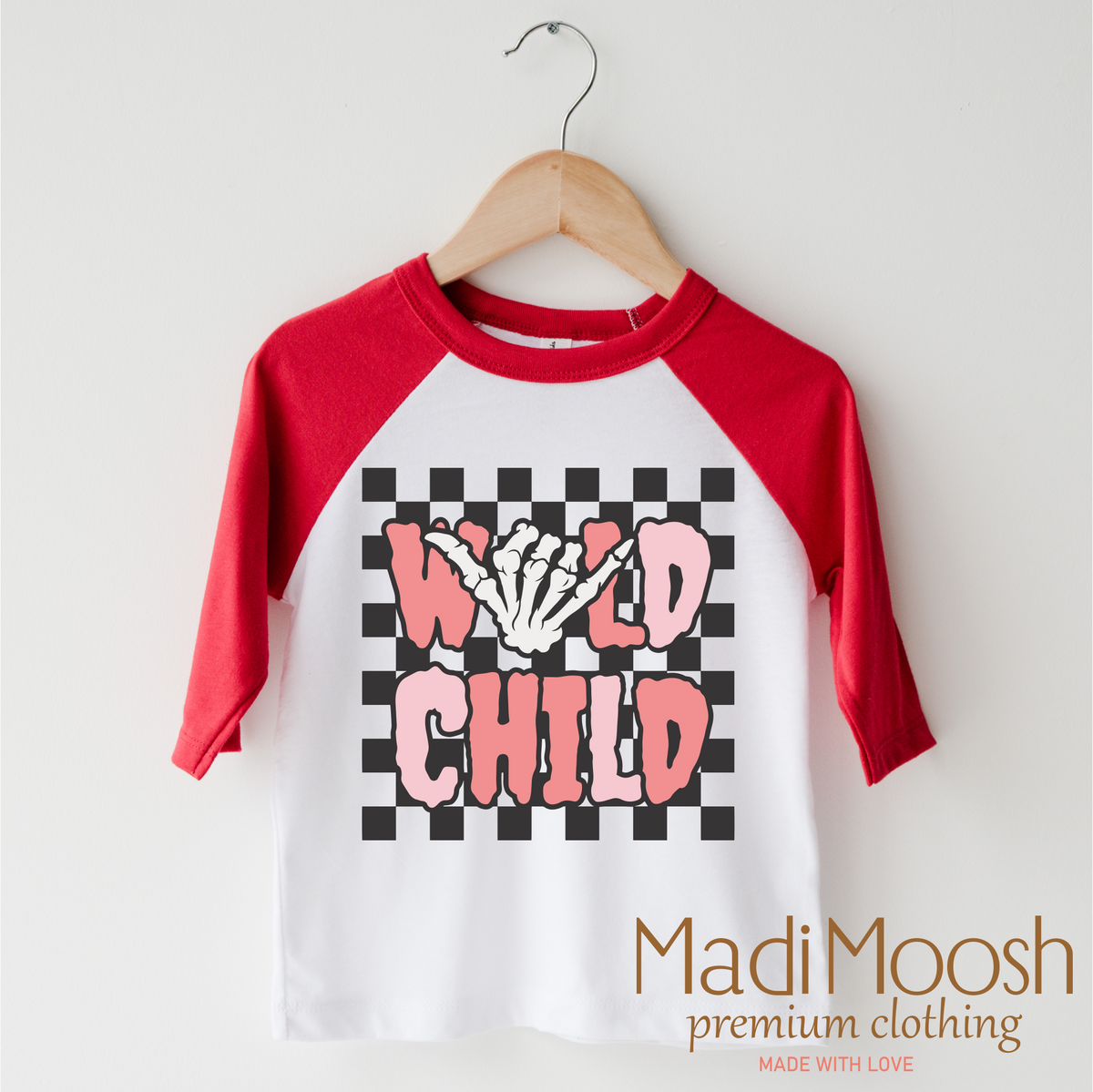 Wild Child Halloween design on a red-accented shirt.