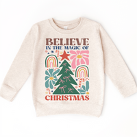 Boho Believe In The Magic Of Christmas design on a natural sweatshirt.