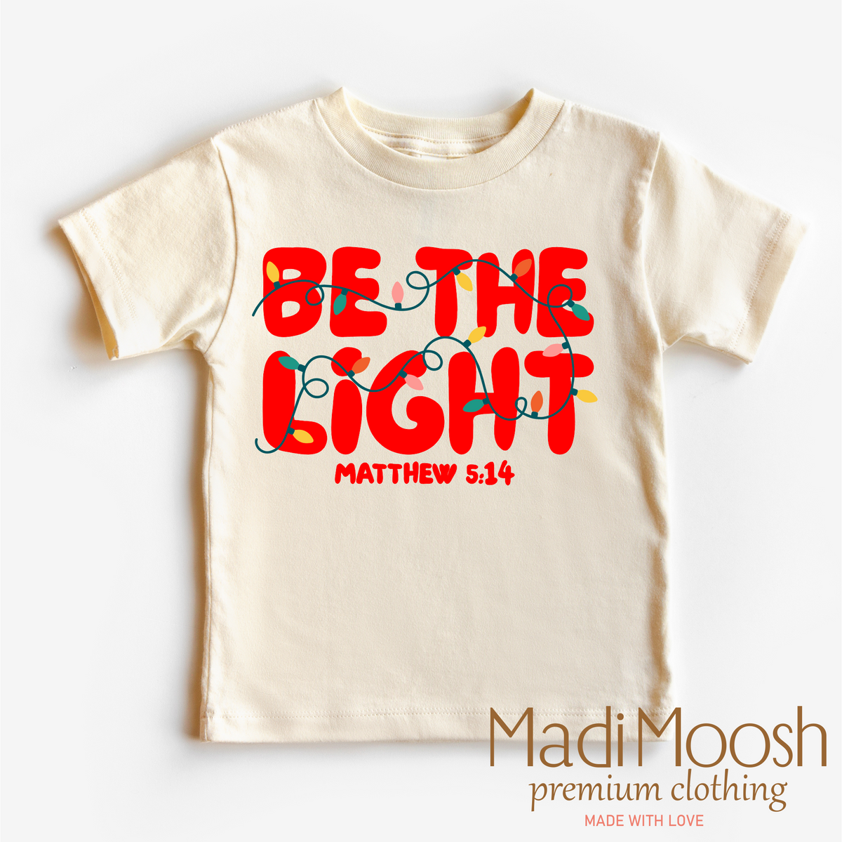 Be The Light Christmas design on a natural garment.