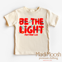 Be The Light Christmas design on a natural garment.
