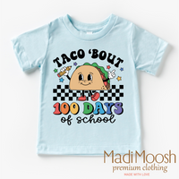Taco Bout 100 Days Of School design on a blue garment.