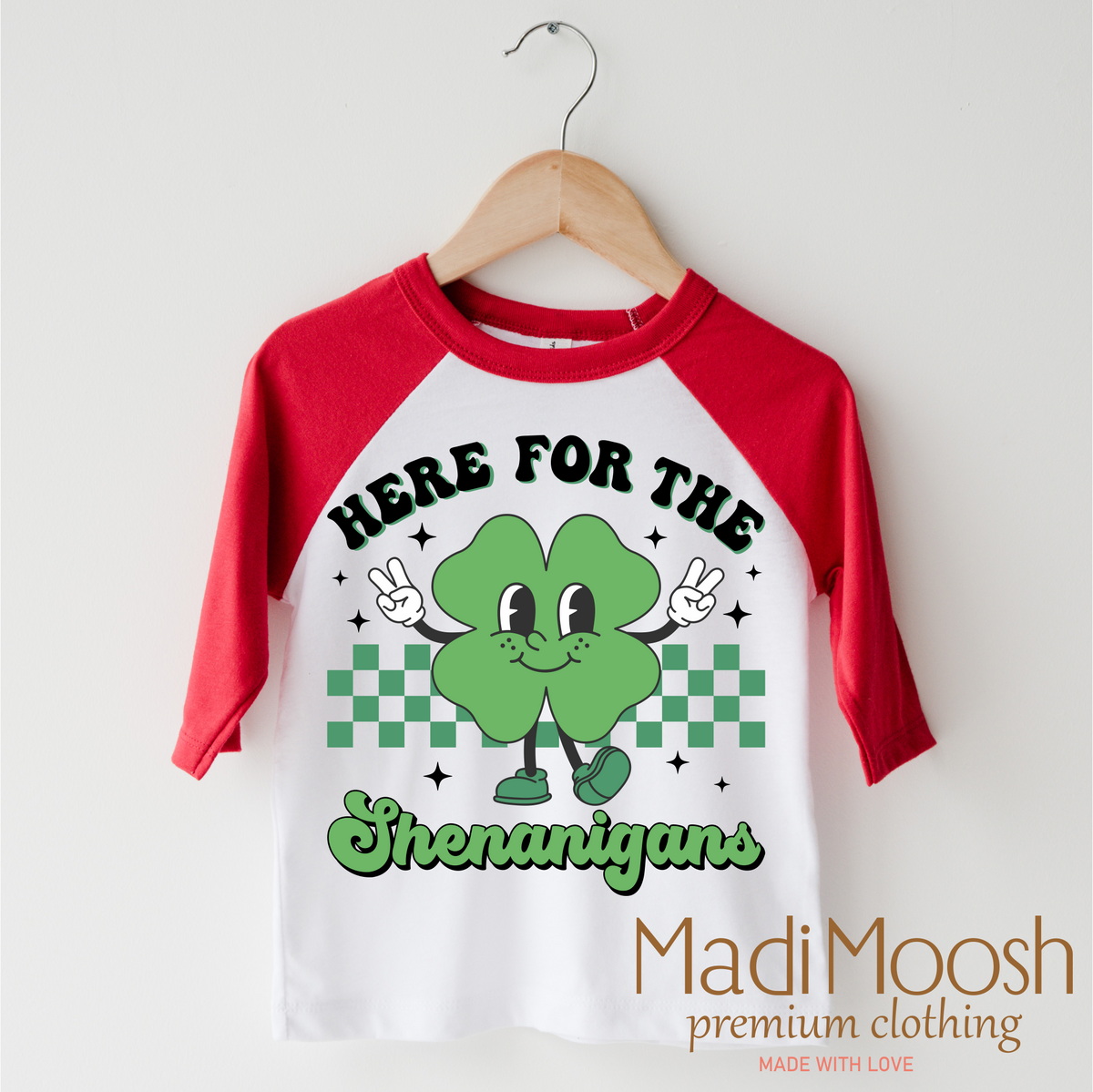 Here For The Shenanigan's St. Patrick's Day design on a red-accented shirt.