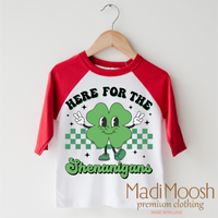 Here For The Shenanigan's St. Patrick's Day design on a red-accented shirt.