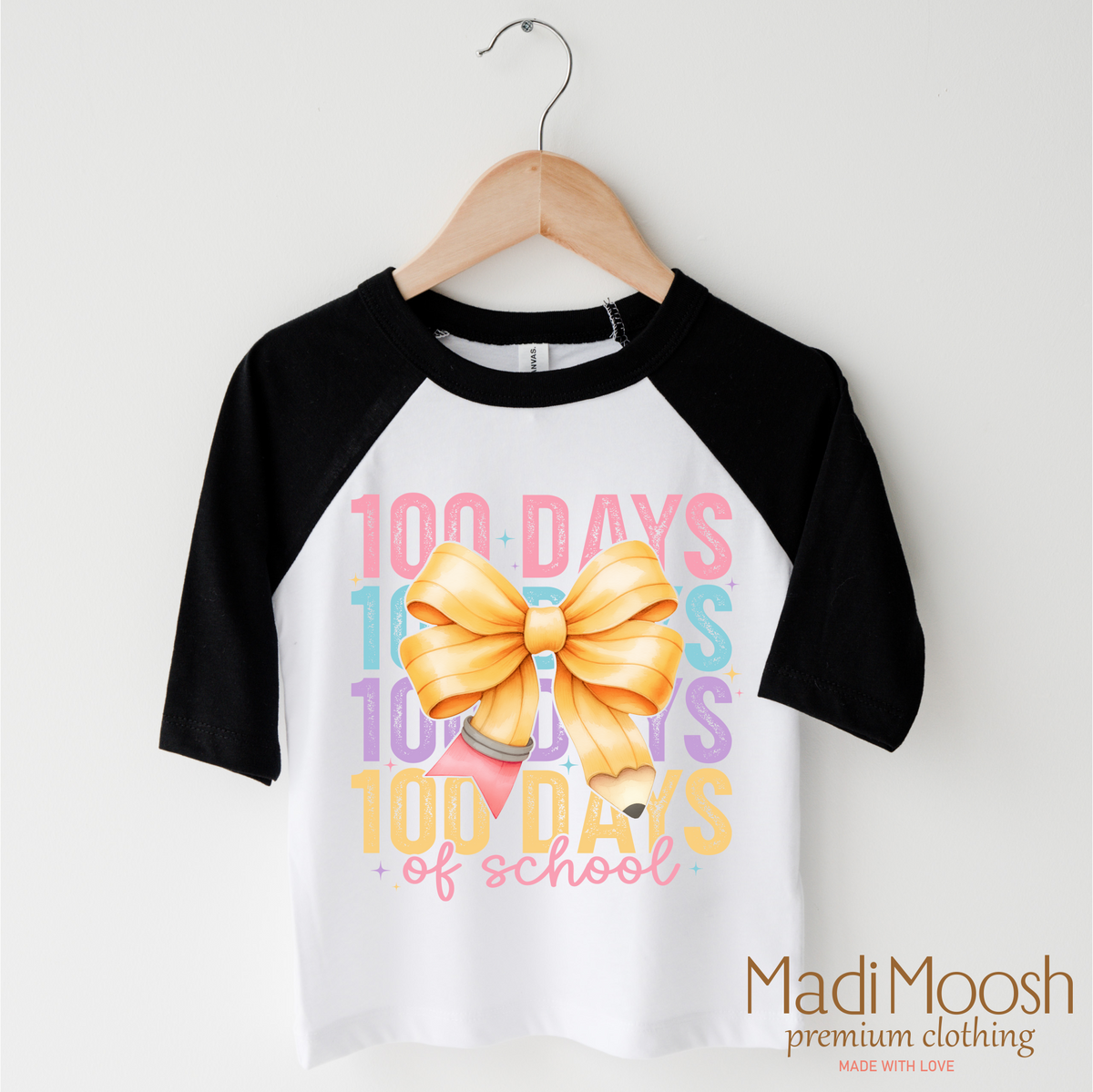 100 Days Of School Bow design on a black-accented shirt.