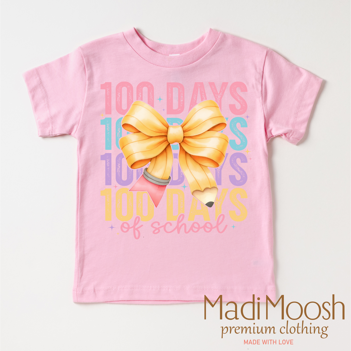 100 Days Of School Bow design on a pink garment.