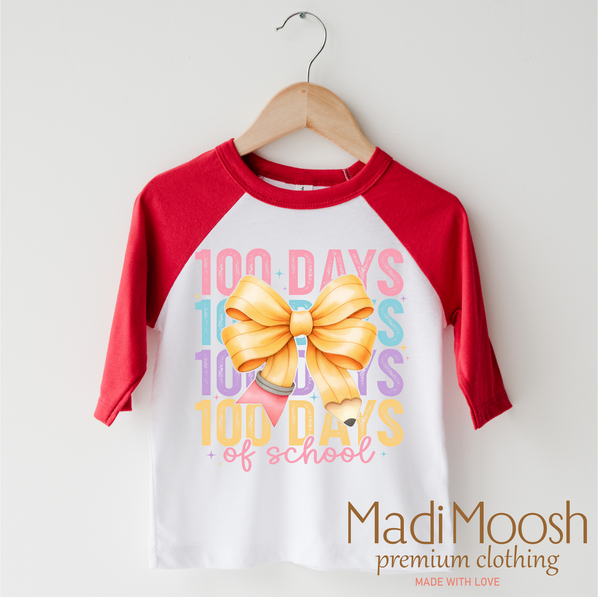 100 Days Of School Bow design on a red-accented shirt.