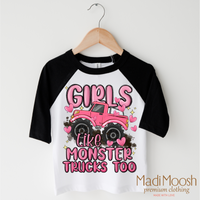 Girls Like Monster Trucks Too design on a black-accented shirt.