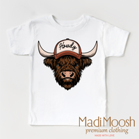 Howdy Highland Cow Western design on a white garment.