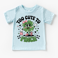 Too Cute To Pinch St. Patrick's Day design on a blue garment.