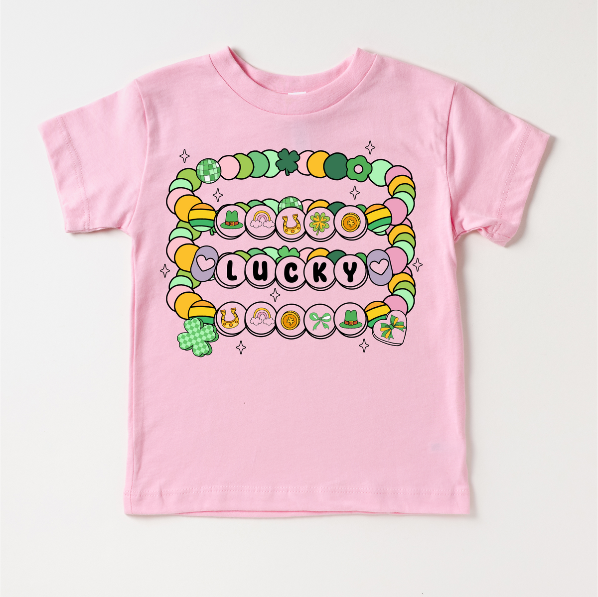 St. Patrick's Day Friendship Bracelet design on a pink garment.
