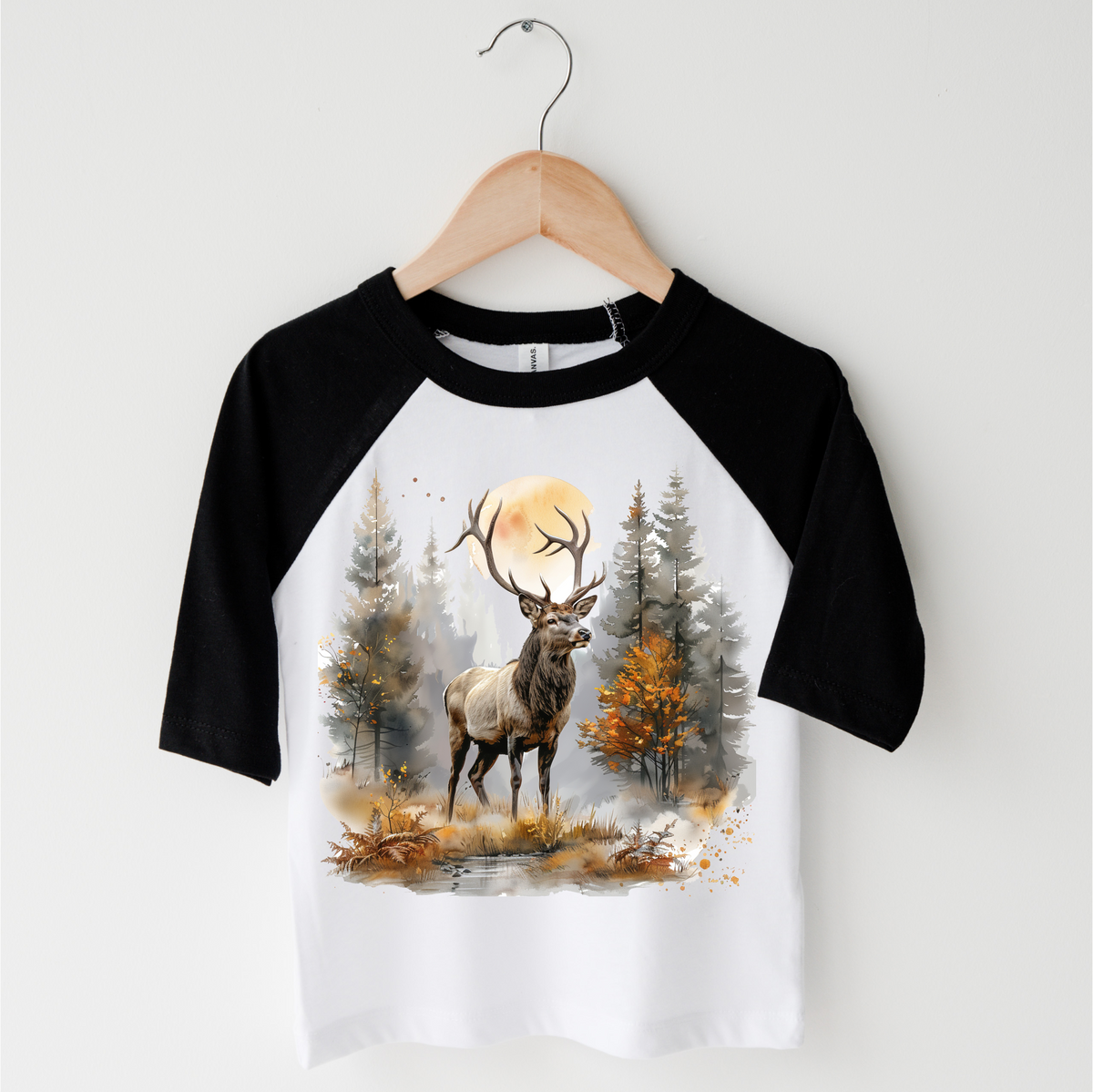 Retro Elk Watercolor Nature Scene design on a black-accented shirt.