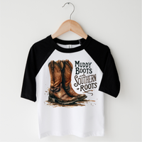 Muddy Boots And Southern Roots design on a black-accented shirt.