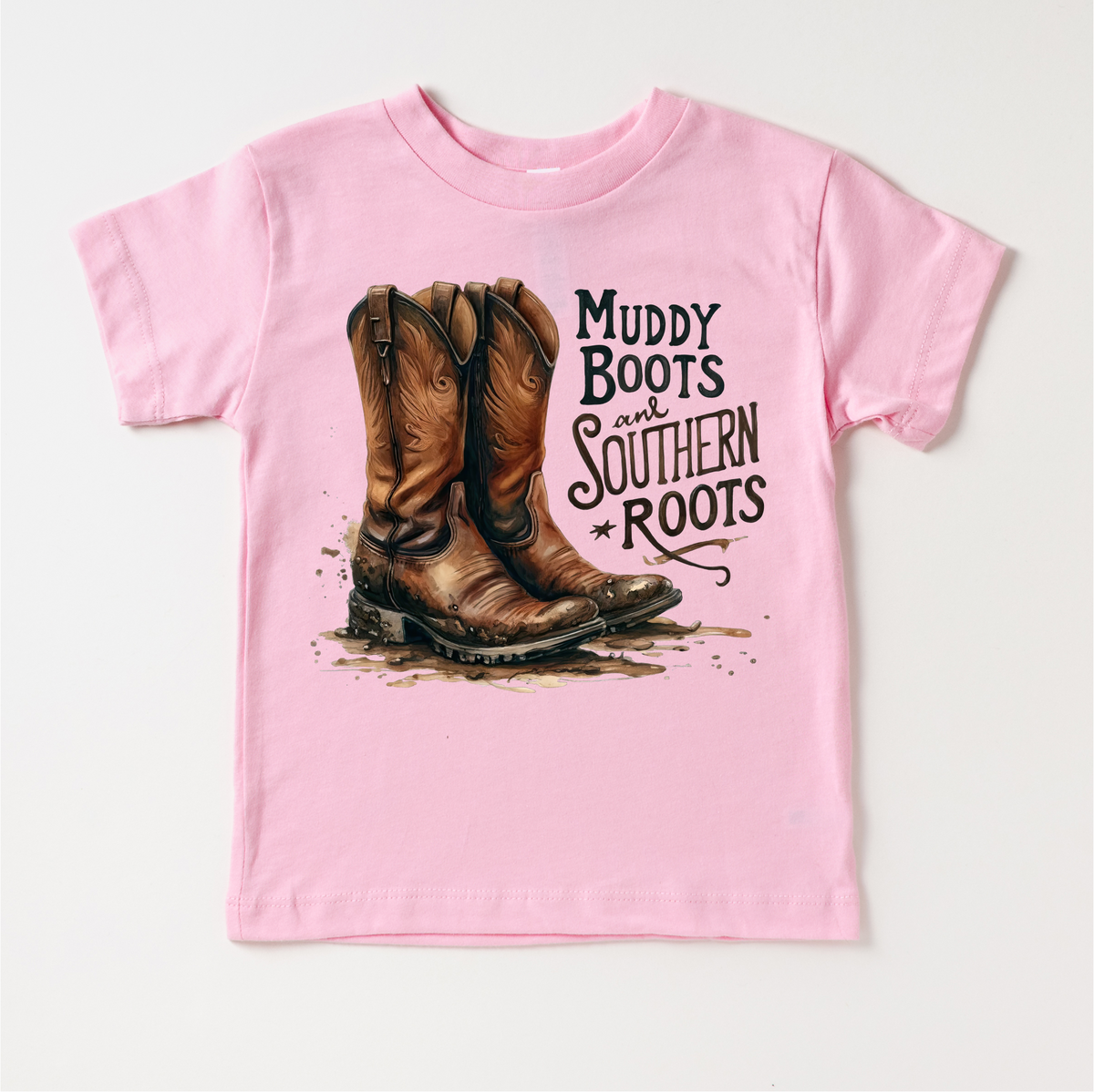 Muddy Boots And Southern Roots design on a pink garment.