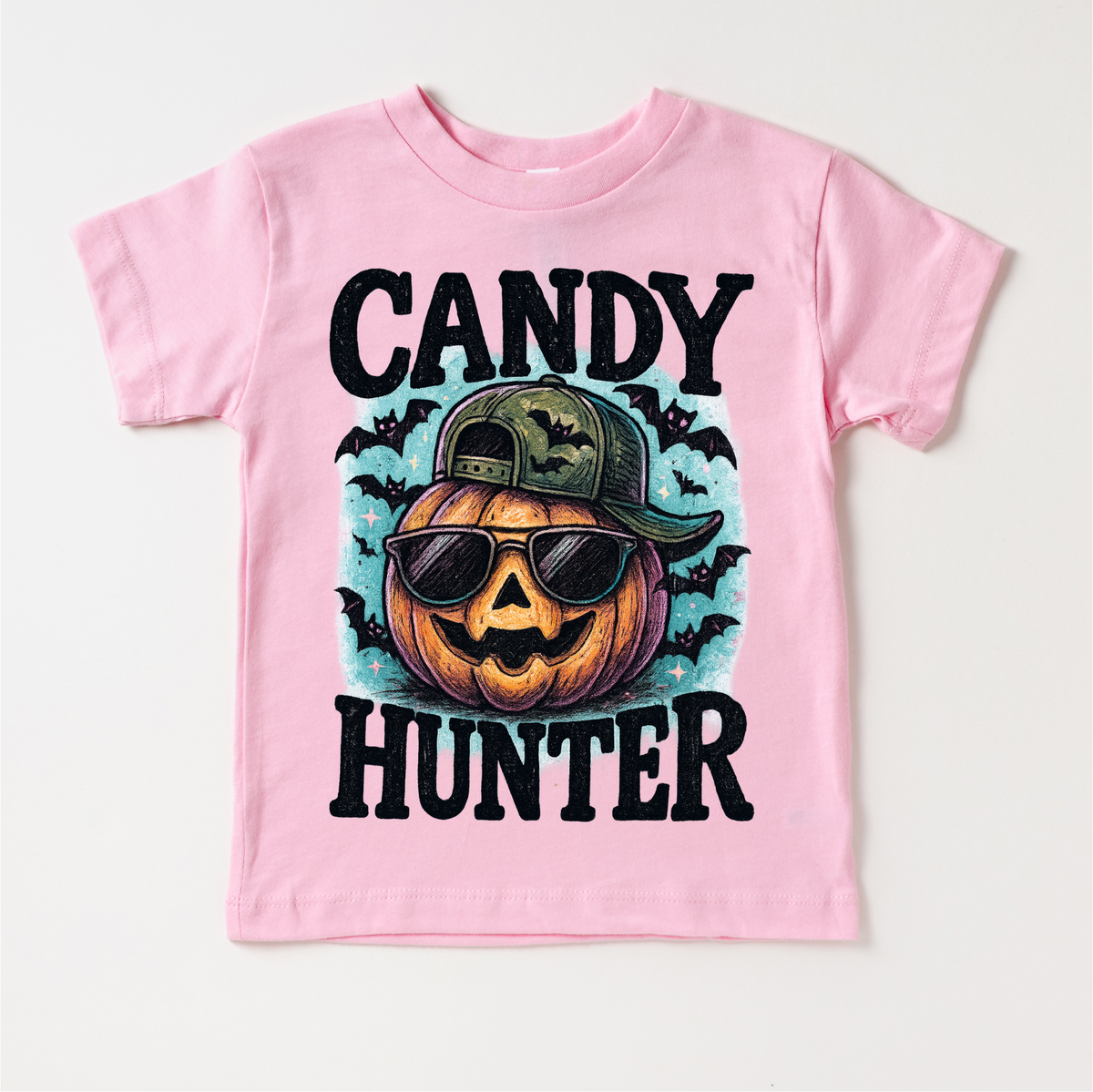 Candy Hunter Halloween design on a pink garment.