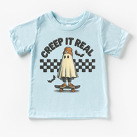 Retro Creep It Reel Skater Halloween design on a blue garment.