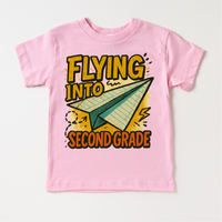 Flying Into Second Grade Back To School design on a pink garment.