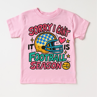 Sorry I Can't It Is Football Season design on a pink garment.