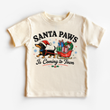 Santa Paws Is Coming to Town natural kids Christmas shirt with a dachshund pulling a sleigh of gifts