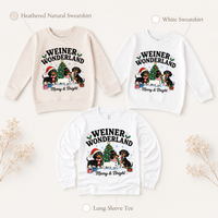 Weiner Wonderland Christmas dachshund design on heathered natural and white sweatshirts and a white long-sleeve tee.