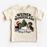 Natural kids T-shirt with Weiner Wonderland dachshunds, a decorated Christmas tree and Merry & Bright lettering.