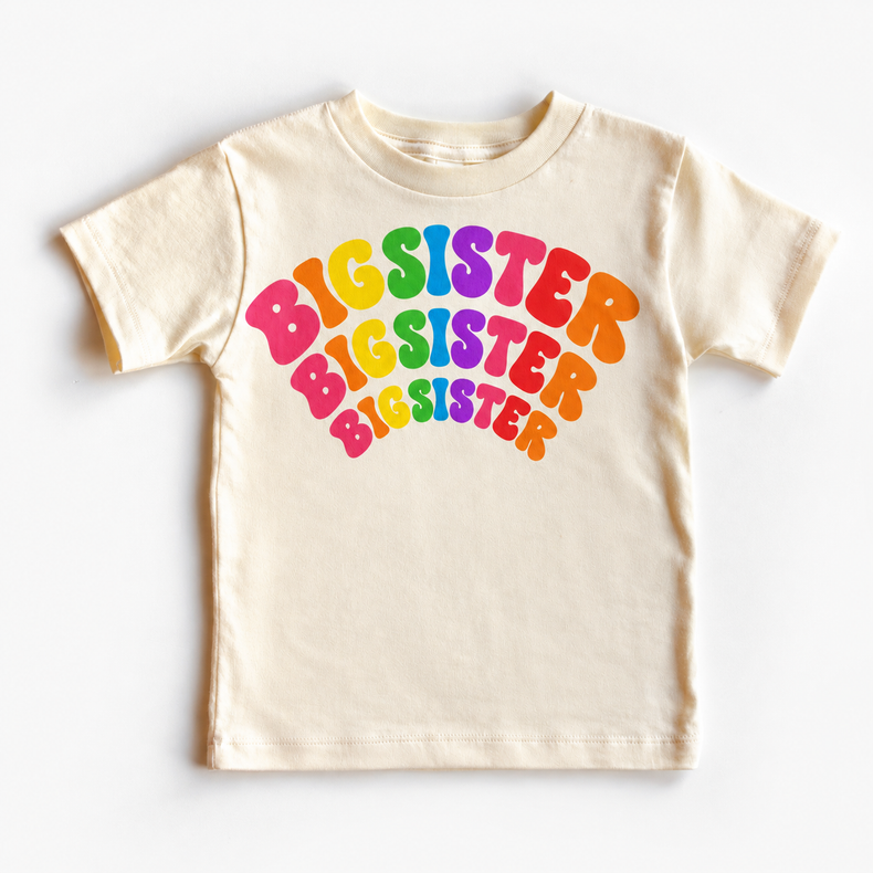 Big Sister rainbow arched lettering on natural tee