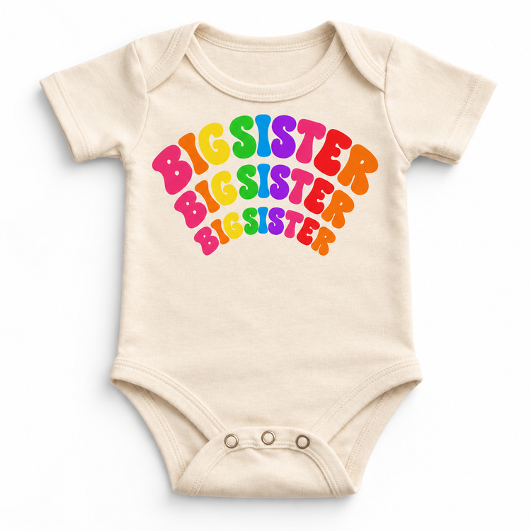 Big Sister rainbow arched lettering on natural baby bodysuit