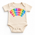 Little Sister rainbow arched lettering on natural baby bodysuit