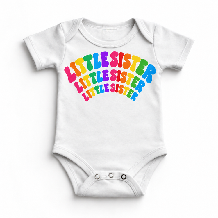 Little Sister rainbow arched lettering on white baby bodysuit
