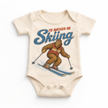 I'd Rather Be Skiing retro Bigfoot design on a natural baby bodysuit