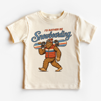 I'd Rather Be Snowboarding retro Bigfoot design on a natural short sleeve tee
