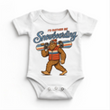 I'd Rather Be Snowboarding retro Bigfoot design on a white baby bodysuit