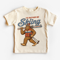 I'd Rather Be Skiing retro Bigfoot carrying skis design on a natural short sleeve tee